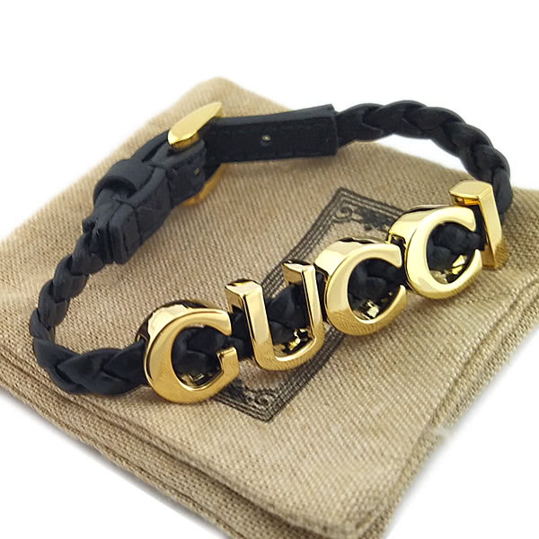 GUCCI 古馳 金色Logo字樣黑色編織皮革中性手環(新款